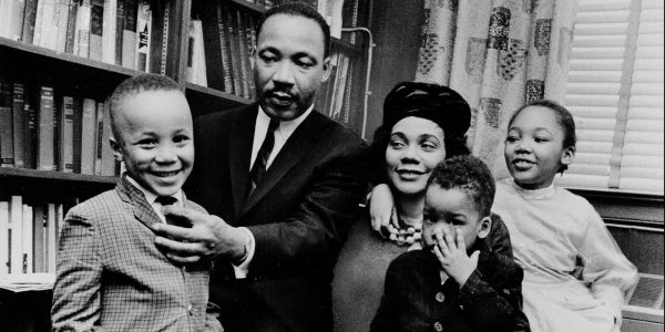 Dr. Martin Luther King Jr. and his wife, Coretta Scott King, sit with three of their four children in their Atlanta, Ga, home, on March 17, 1963.