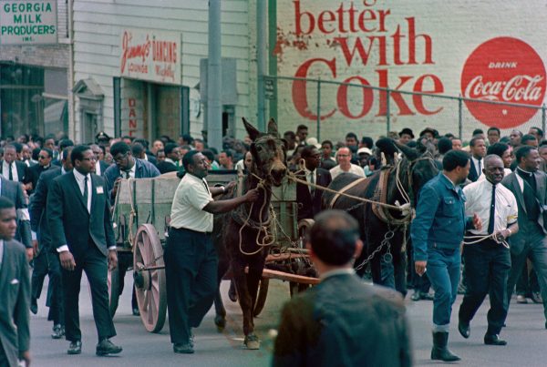 A wooden farm wagon drawn by two local mules carries the casket of Martin Luther King Jr. during a funeral procession in Atlanta, Ga., April 9, 1968.